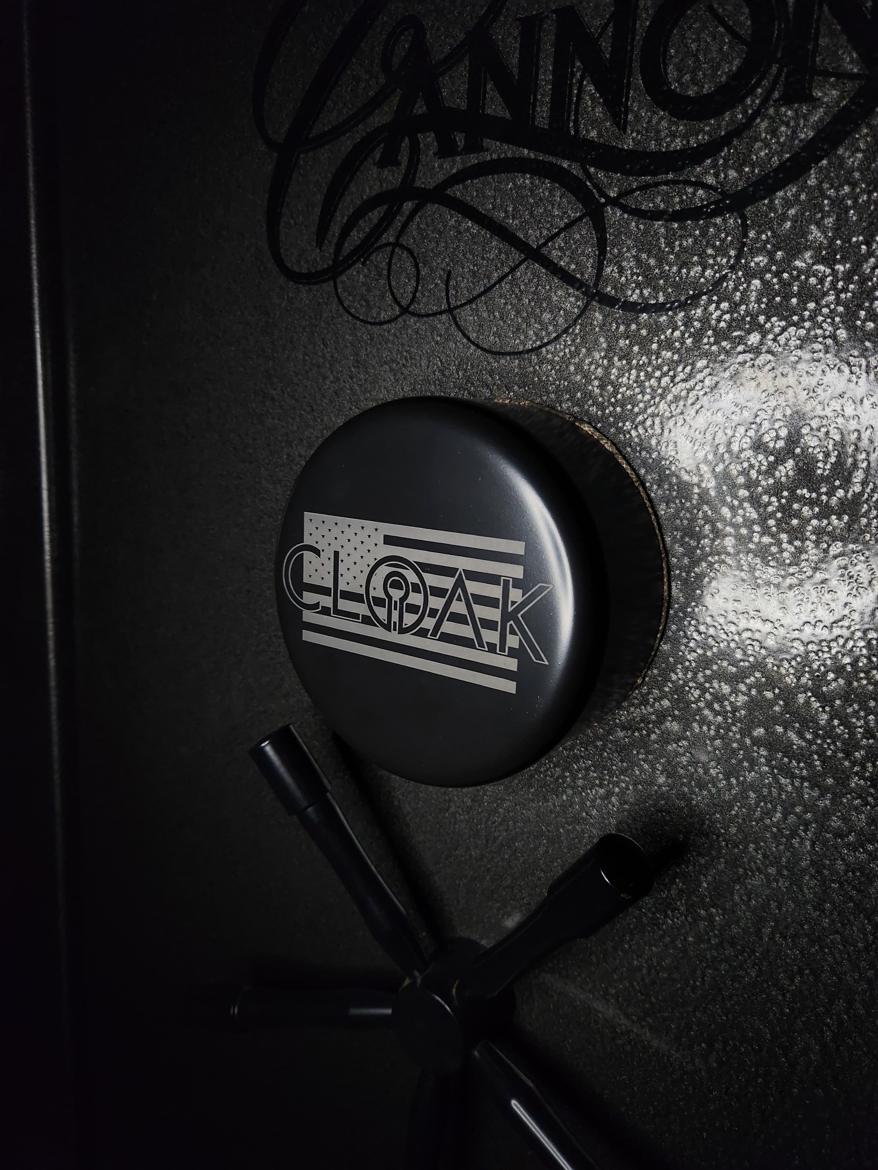 CLOAK keypad shield installed on an electronic safe door, covering the keypad next to the handle